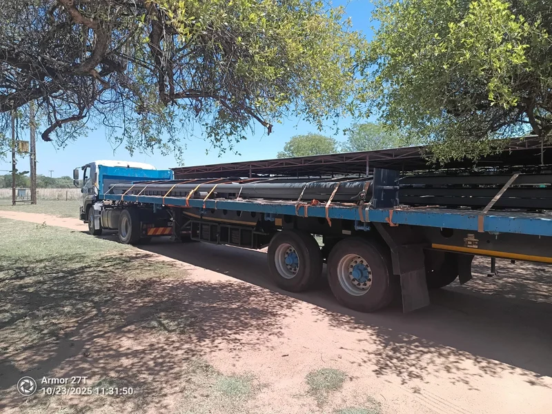 Interlink loaded for a long haul: Roller shutter components loaded and strapped on an interlink for an out-of-town installation.