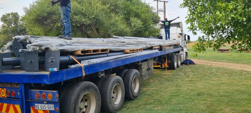 Curtains for 10 m-wide doors: Roller door curtains wrapped and loaded for another client with 10 m-wide openings — protected for the long road to site.